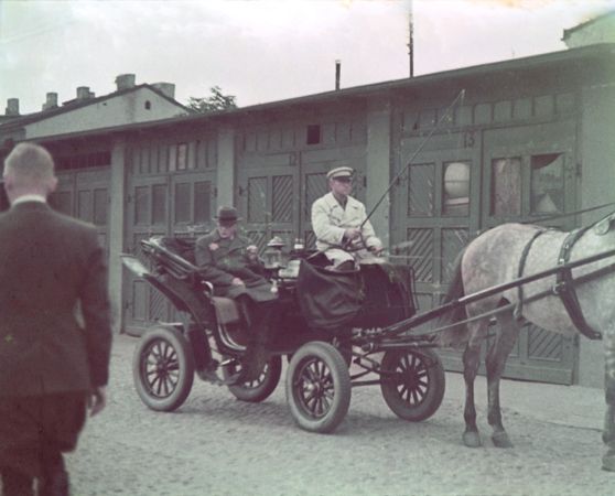 Rumkowski rides through the Lodz ghetto in a horse-drawn carriage